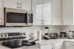 Metro View 2BR | Free Parking I King Bed Workspace - Image 4