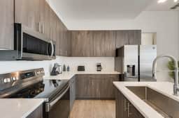 Sleek loft style 2BR I Gym I Parking I Workspace - Image 4