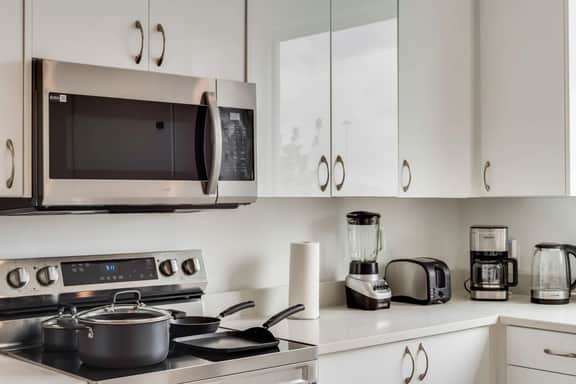 Metro View 2BR | Free Parking I King Bed Workspace - Image 4