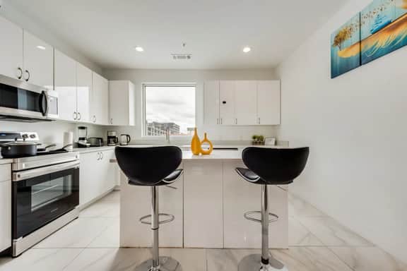 Metro View 2BR | Free Parking I King Bed Workspace - Image 3